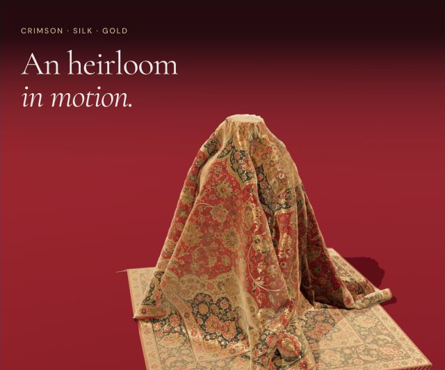 Intricate crimson-and-gold Persian carpet design with a central floral medallion, curling vines, and elaborate borders